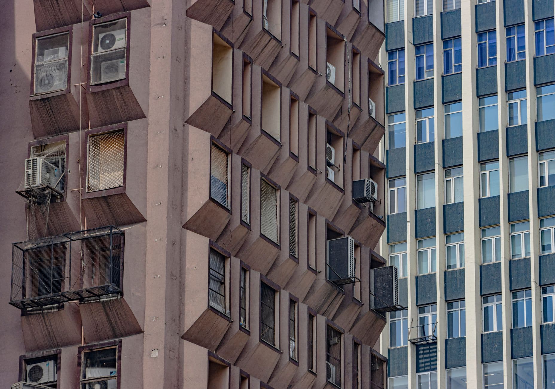 A striking view of brutalist architecture showcasing symmetry in New Delhi, India.
