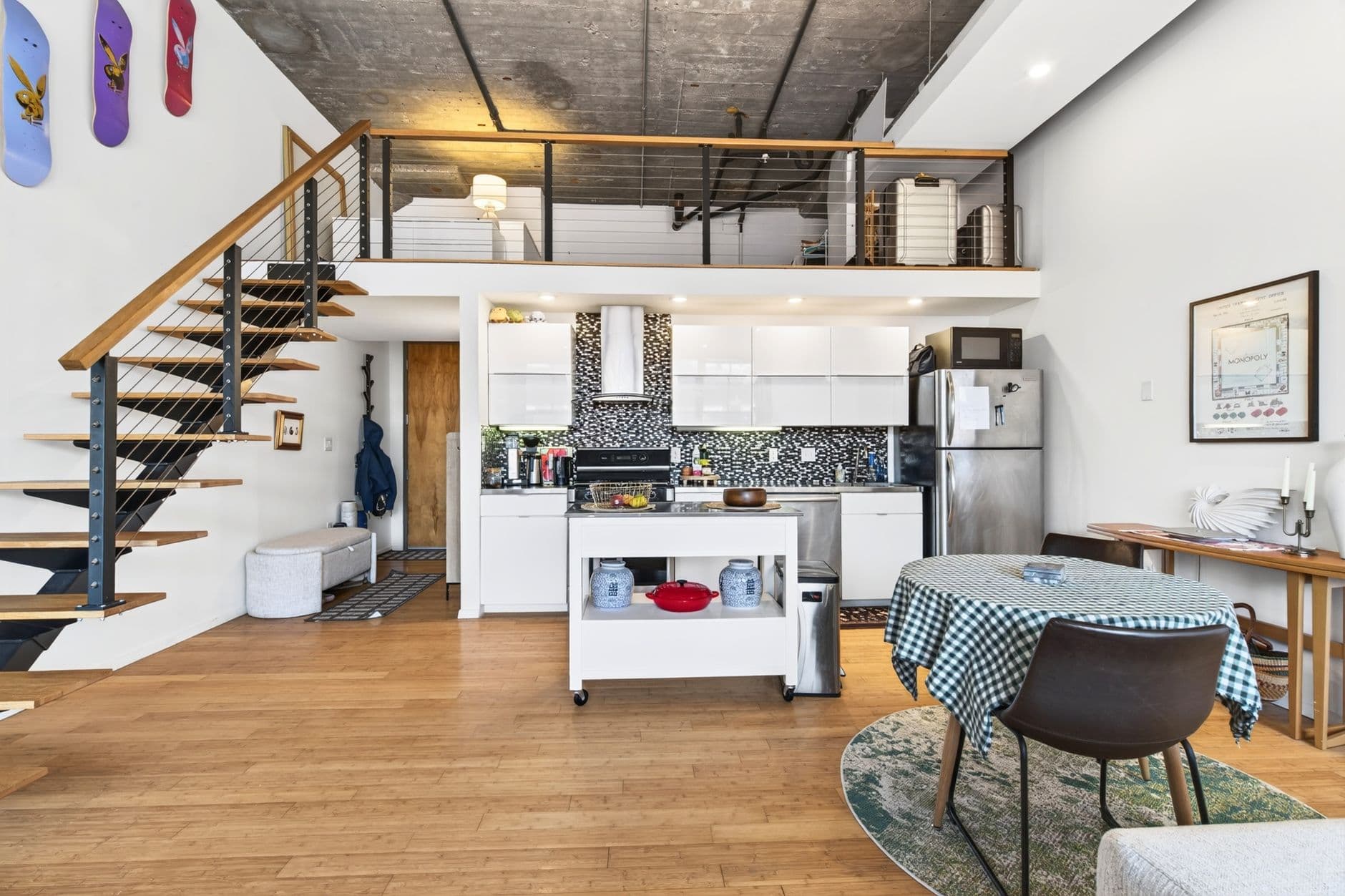 Spacious and stylish loft apartment in Boston, featuring a modern kitchen and unique industrial design.