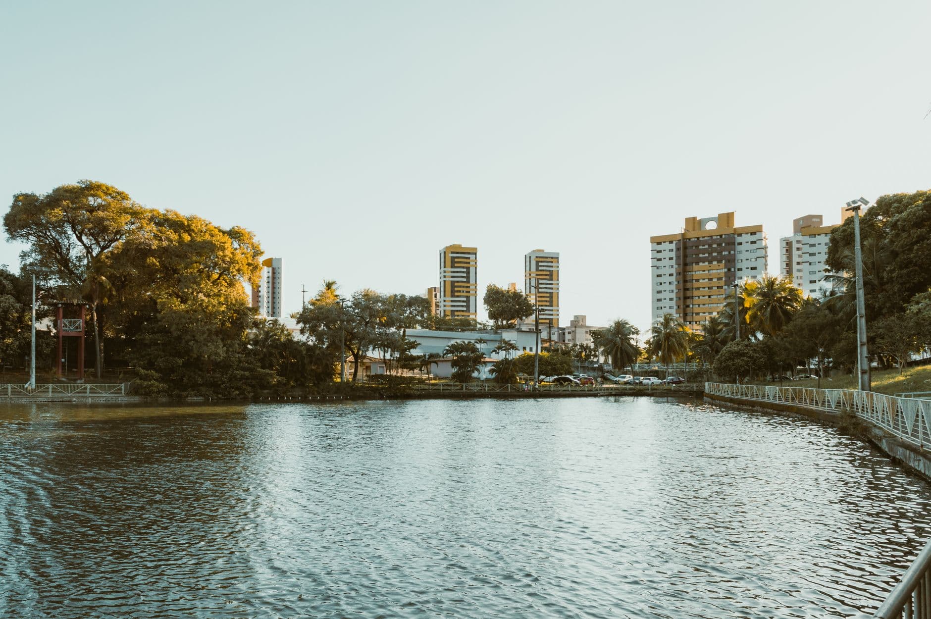 Scenic view of a waterfront with modern buildings in Natal, RN, Brazil during a sunny day.