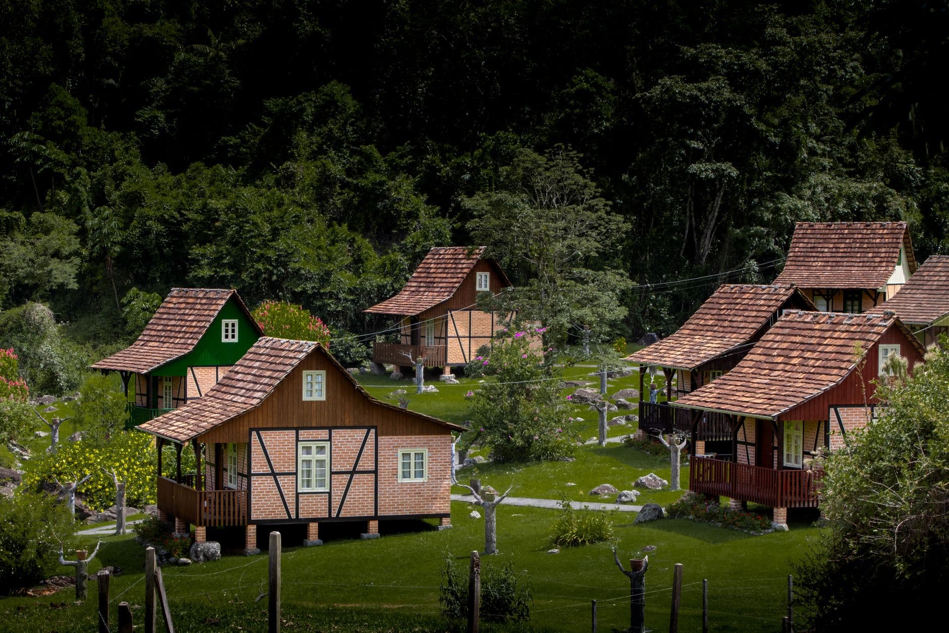 Picturesque cottages nestled in lush greenery in Santa Catarina, Brazil.