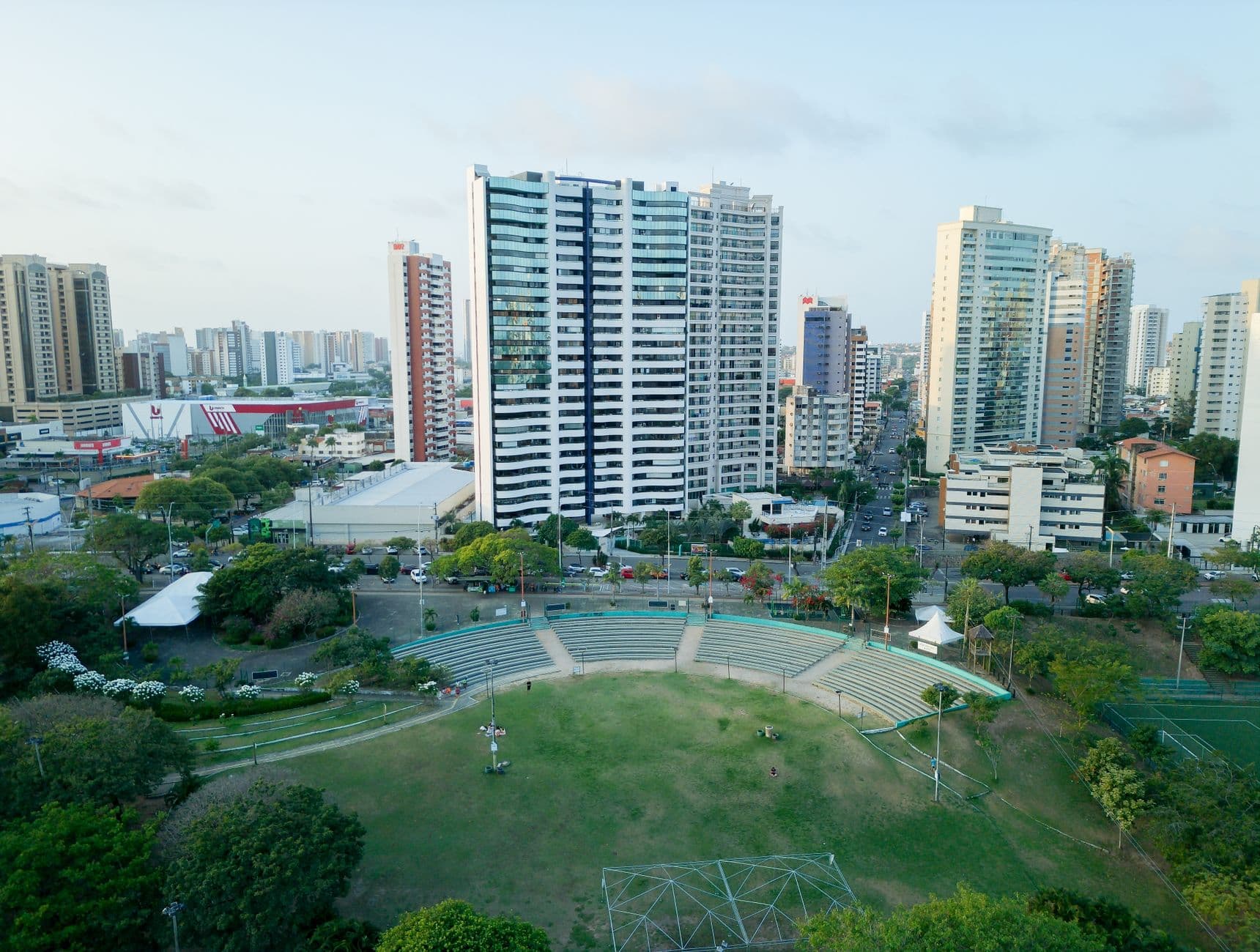 Aerial view of Fortaleza cityscape showing skyscrapers, parks, and urban greenery.